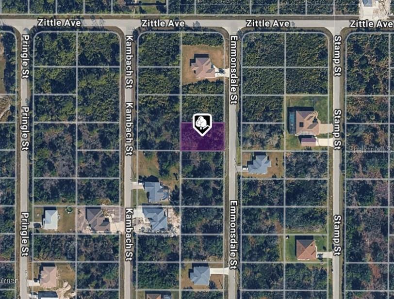 This is an aerial map showing a vacant rectangular lot highlighted in purple — 6167 EMMONSDALE STREET, PORT CHARLOTTE, FL