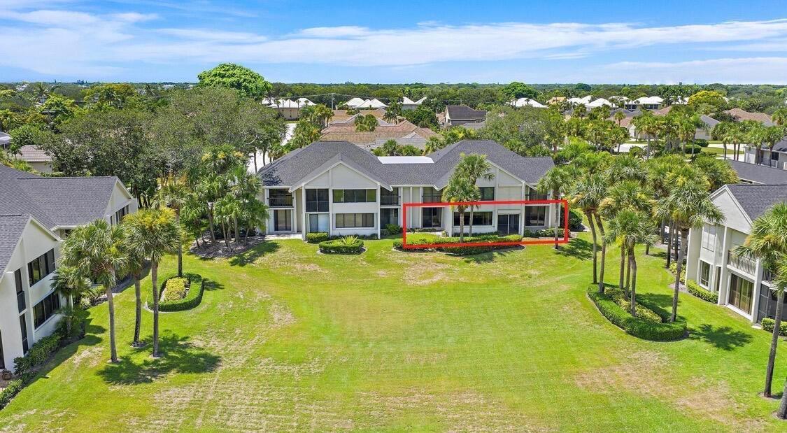 An aerial view of a multi-unit residential building with a red box highlighting a patio — 10459 SE Terrapin Place # 101d, Jupiter FL 33469, JUPITER, FL