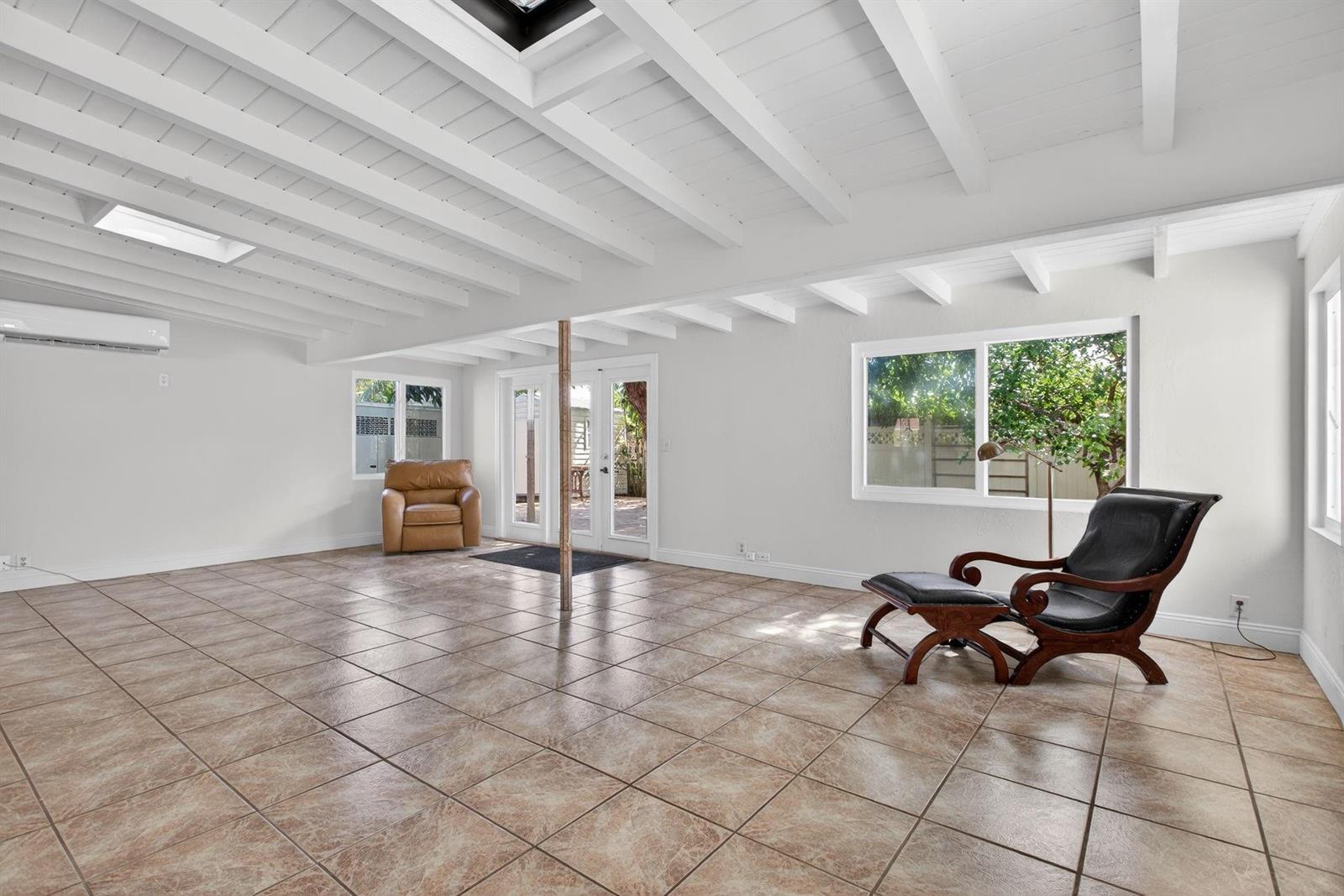 A single-story house with a brick driveway, palm trees, and a two-car garage — 2580 SE 5th Court, Pompano Beach FL 33062, POMPANO BEACH, FL