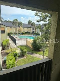 A view from a balcony overlooking a swimming pool and apartment complex — 914 LAKE DESTINY ROAD UNIT H, ALTAMONTE SPRINGS, FL