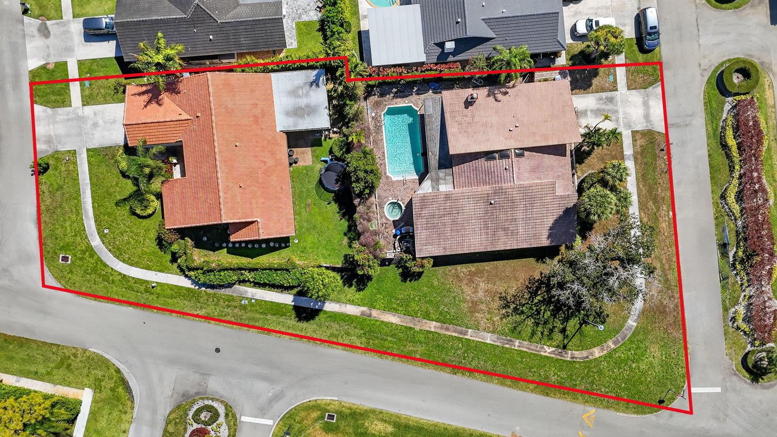 An aerial view shows two houses on a corner lot with a swimming pool — 22207 Alyssum Way, Boca Raton FL 33433, BOCA RATON, FL