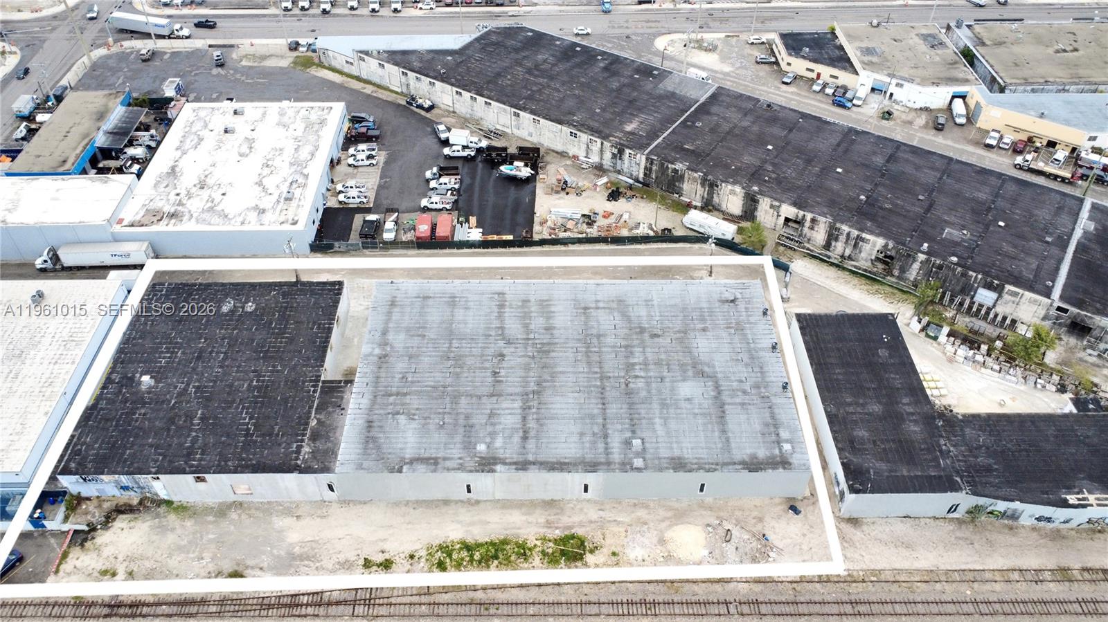 An aerial view shows a large industrial building with a flat roof and surrounding lot — 7000 NW 37th Ct, Hialeah FL 33147, HIALEAH, FL
