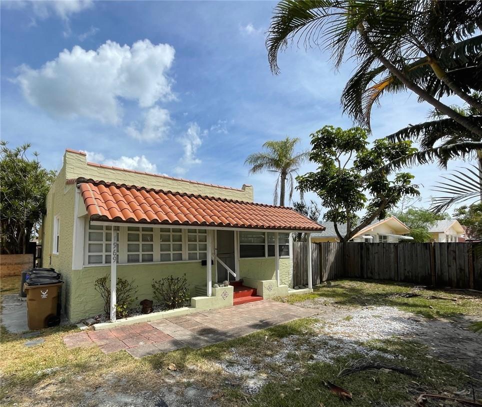 A light green house with a red tile roof and a front patio — 1969 NE 4th Street, Deerfield Beach FL 33441, DEERFIELD BEACH, FL