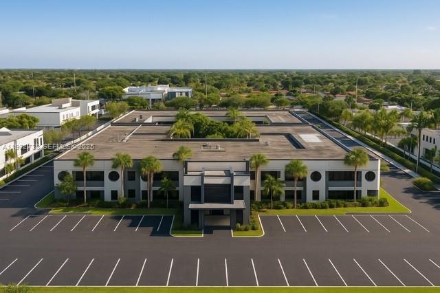 An aerial view shows a two-story commercial office building with a central courtyard and parking — 9350 SW 72nd St, Miami FL 33173, MIAMI, FL