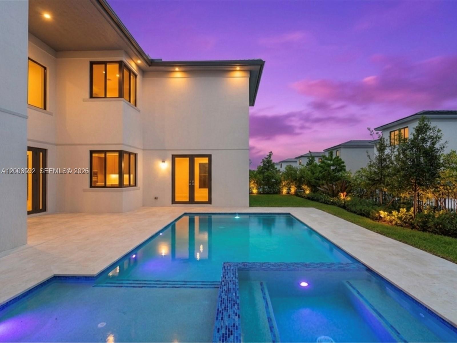 A modern two-story house with a swimming pool and spa at sunset — 19602 NE 14 CT # 0, Miami FL 33179, MIAMI, FL