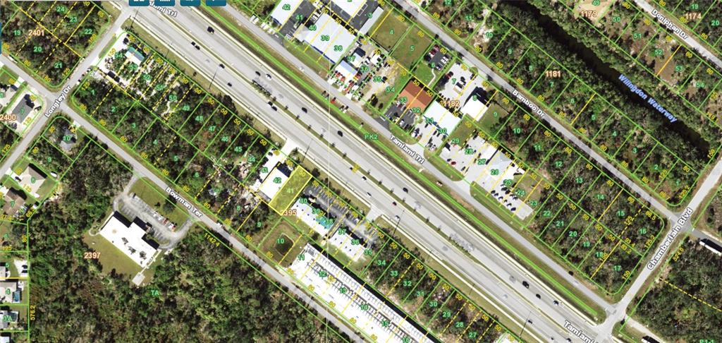 This is an aerial map showing land parcels along Tamiami Trail and surrounding streets — 521 TAMIAMI TRAIL, PORT CHARLOTTE, FL