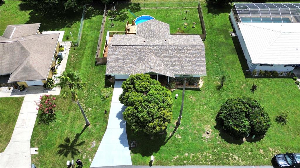An aerial view shows a house with a wooden deck and an above-ground swimming pool — 3103 N WOOLFLOWER TERRACE, BEVERLY HILLS, FL
