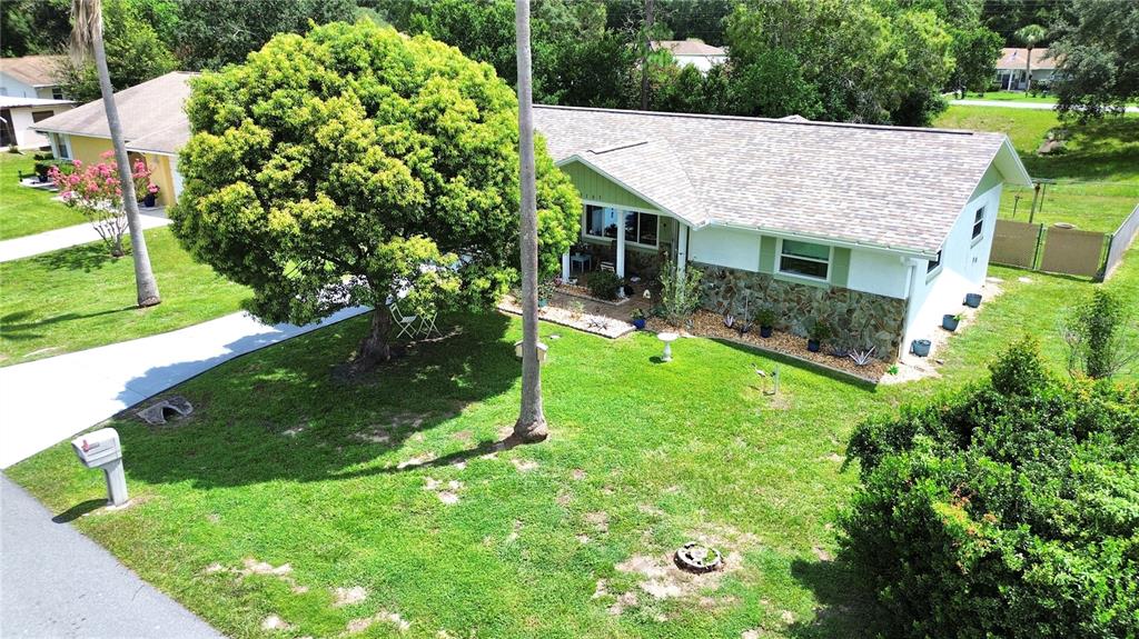 An aerial view shows a house with a shingled roof, backyard pool, and fenced deck — 3103 N WOOLFLOWER TERRACE, BEVERLY HILLS, FL