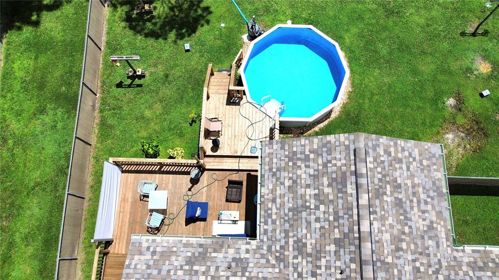 An aerial view of a single-story house with a stone facade and a large tree — 3103 N WOOLFLOWER TERRACE, BEVERLY HILLS, FL