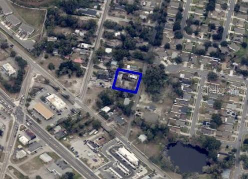An aerial view shows a residential property highlighted by a blue border — 210 N NEW HAMPSHIRE AVENUE, APOPKA, FL