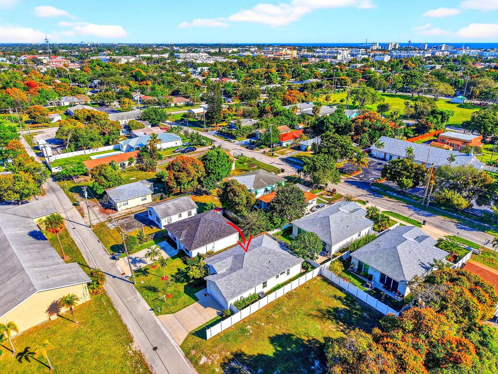 An aerial view of a suburban neighborhood featuring a house with a red arrow — 341 Oak Alley, Delray Beach FL 33444, DELRAY BEACH, FL