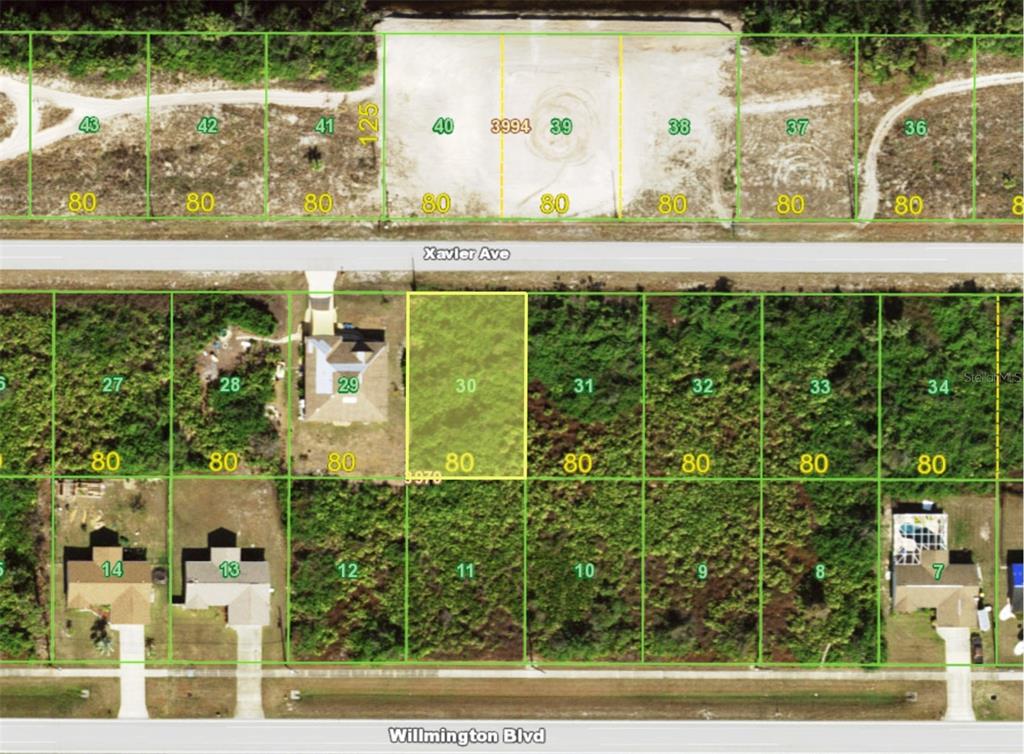 This is a map showing a grid of residential land lots along Xavier Avenue and Willmington Boulevard — 12825 XAVIER AVENUE, PORT CHARLOTTE, FL