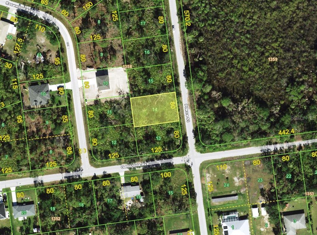 This is a satellite map showing a highlighted vacant residential lot in a wooded area — 3499 PIERCE STREET, PORT CHARLOTTE, FL