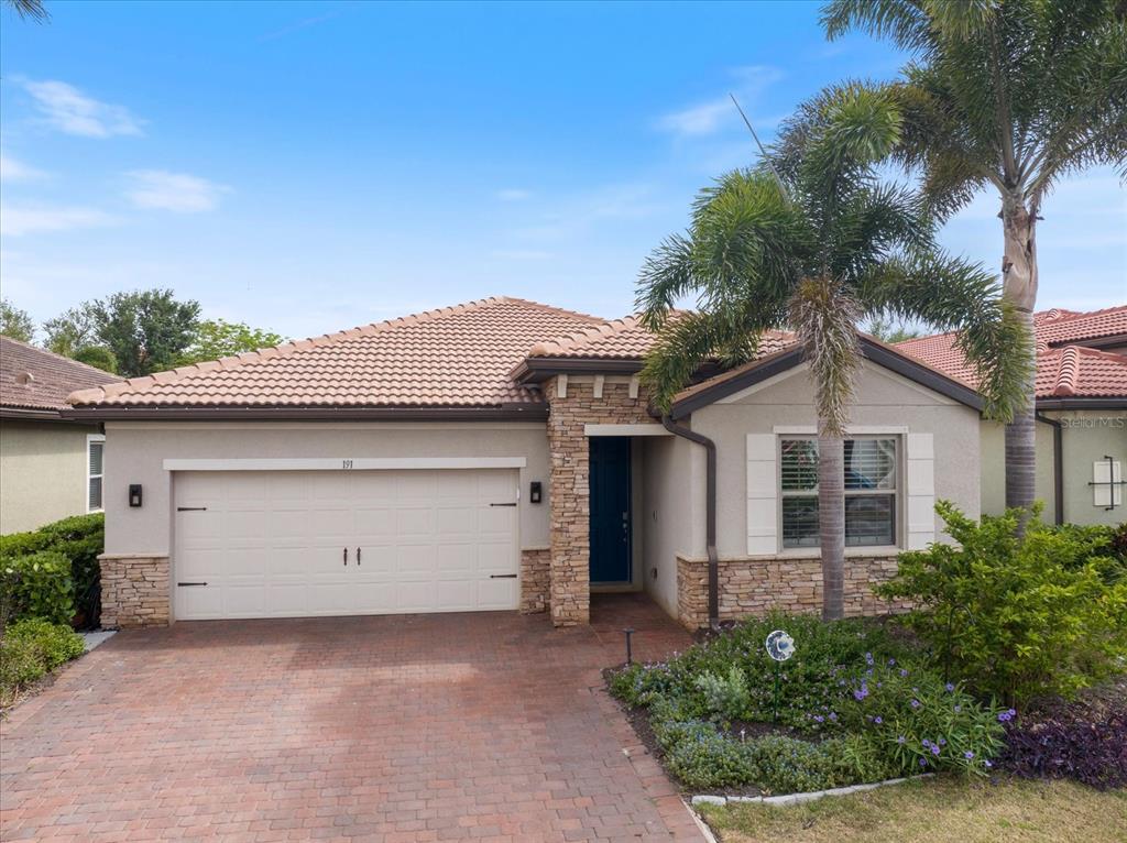 An aerial view shows a residential house with a screened pool enclosure and backyard — 191 MARAVIYA BOULEVARD, NORTH VENICE, FL