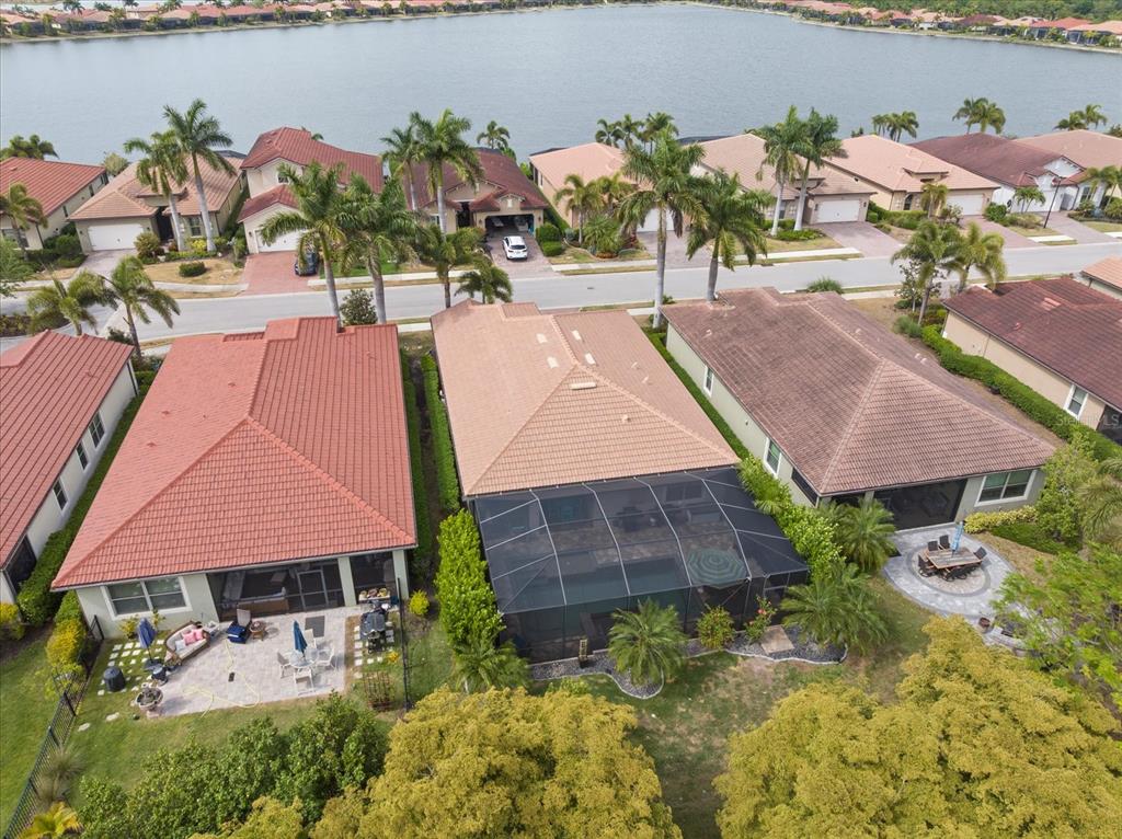 A single-story house with a brick driveway, stone accents, and a palm tree in front — 191 MARAVIYA BOULEVARD, NORTH VENICE, FL