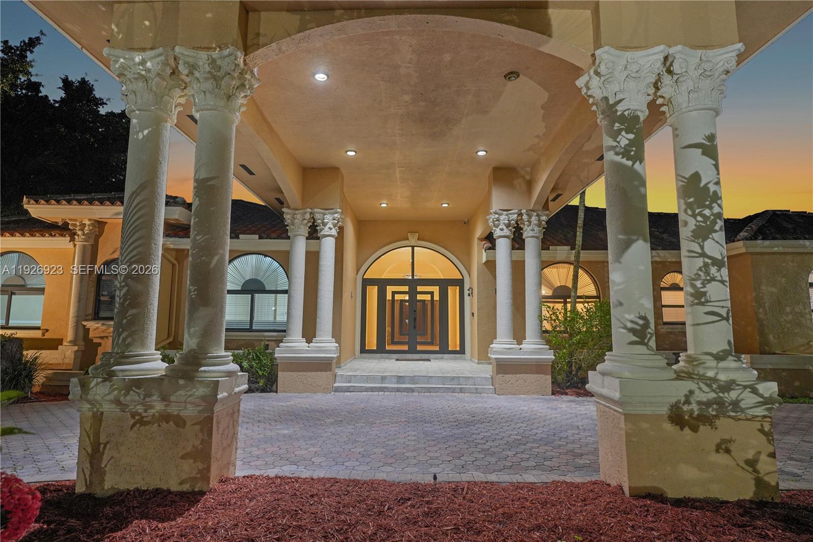 A grand entrance features a covered portico with decorative columns and a glass-paneled double door — 3001 SW 132nd Ave, Miami FL 33175, MIAMI, FL