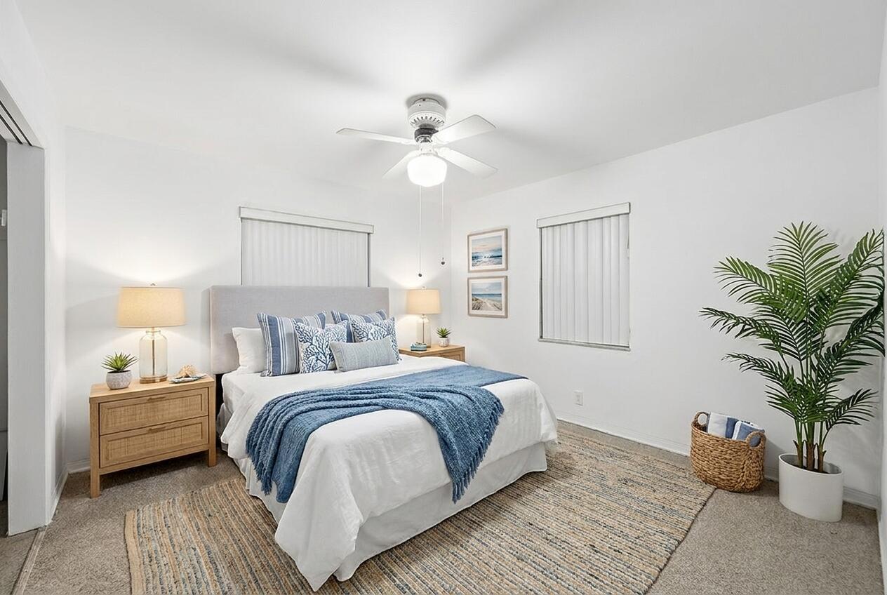 A bedroom with a queen bed, two nightstands, a ceiling fan, and a potted plant — 1716 N 25th Avenue, Hollywood FL 33020, HOLLYWOOD, FL