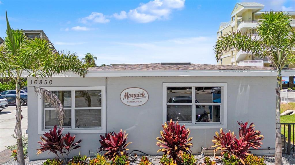 The exterior of a single-story building features a Marwick Condominium sign and palm trees — 16850 GULF BOULEVARD UNIT 4, NORTH REDINGTON BEACH, FL