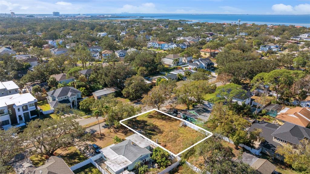 An aerial view shows a vacant rectangular lot outlined in white within a residential neighborhood — 4621 W EL PRADO BOULEVARD, TAMPA, FL