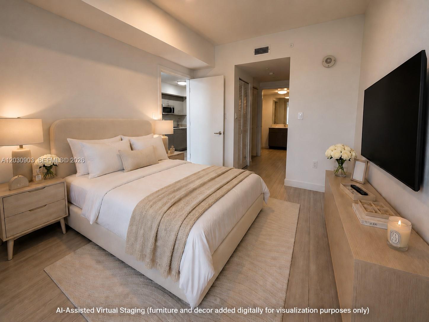A bedroom features a bed, a television, and light wood flooring with virtual staging — 321 NE 26th St # 601, Miami FL 33137, MIAMI, FL