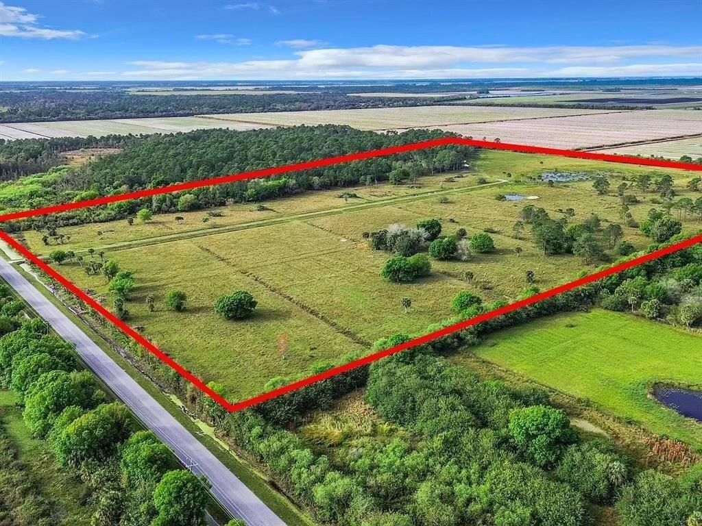 An aerial view shows a large, rectangular grassy plot of land outlined in red — 2777 Everhigh Acres Road Road, Clewiston FL 33440, CLEWISTON, FL