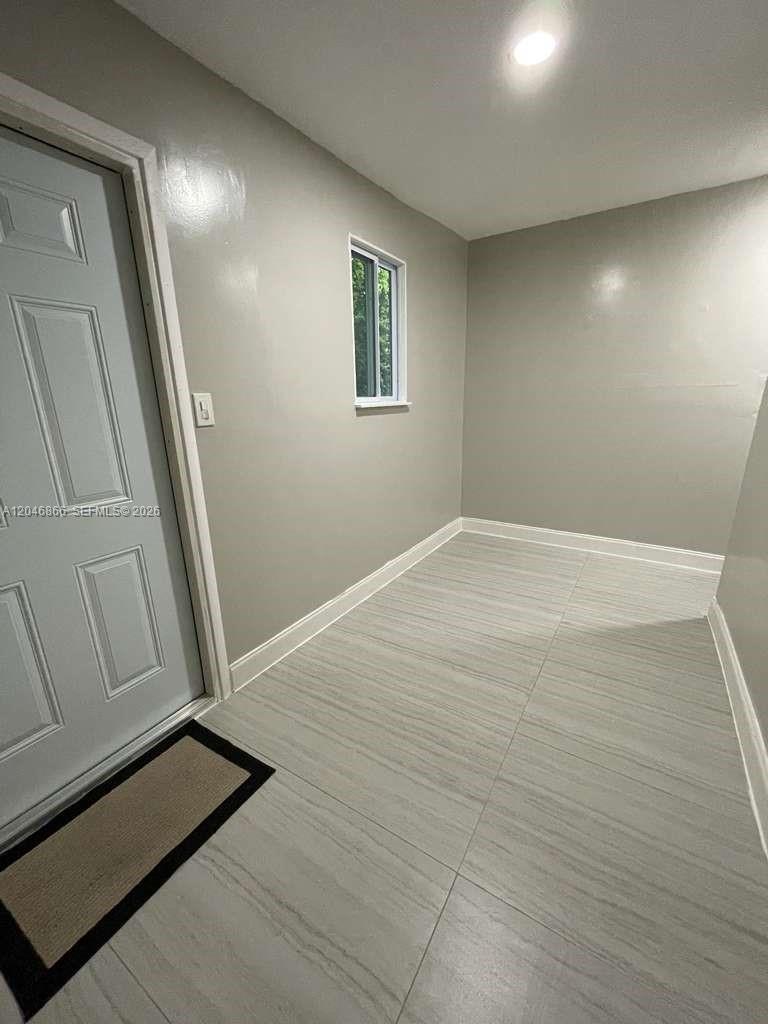 A small room with light gray walls, white trim, and light-colored tile flooring — 11730 SW 172nd St # 0, Miami FL 33177, MIAMI, FL