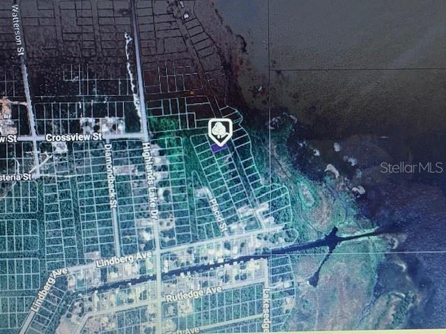 This is an aerial map showing a vacant lot highlighted in a residential neighborhood — 744 LAKEMONT DRIVE, LAKE PLACID, FL