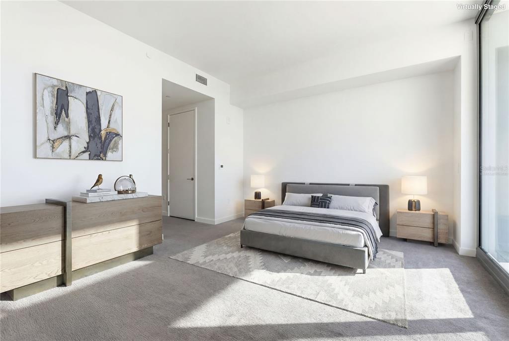 A virtually staged bedroom features a grey bed, two nightstands, a dresser, and carpeted flooring — 400 CENTRAL AVENUE UNIT 3506, ST PETERSBURG, FL