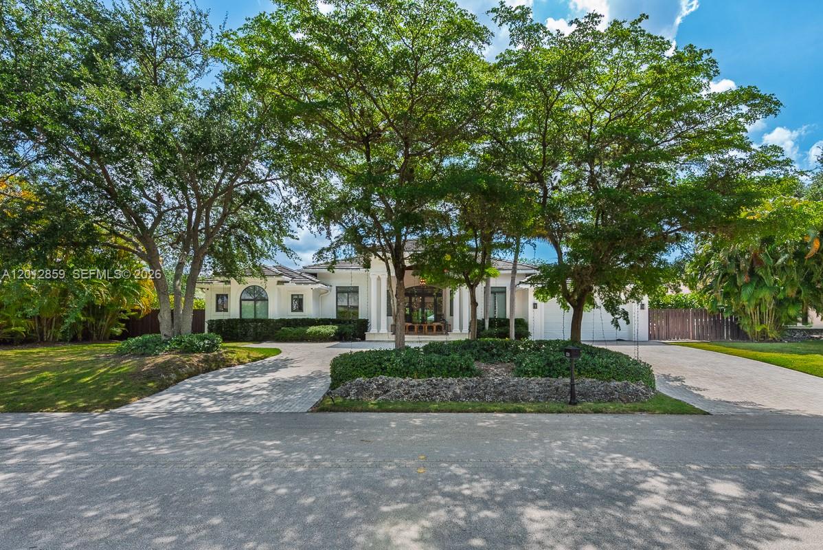 A single-story house with a circular driveway and large trees in the front yard — 12311 SW 94th Ave, Miami FL 33176, MIAMI, FL