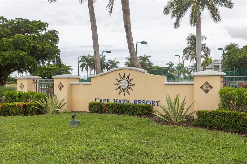 A beige stucco monument sign for Cape Haze Resort stands in a grassy area — 8403 PLACIDA ROAD UNIT 303, PLACIDA, FL