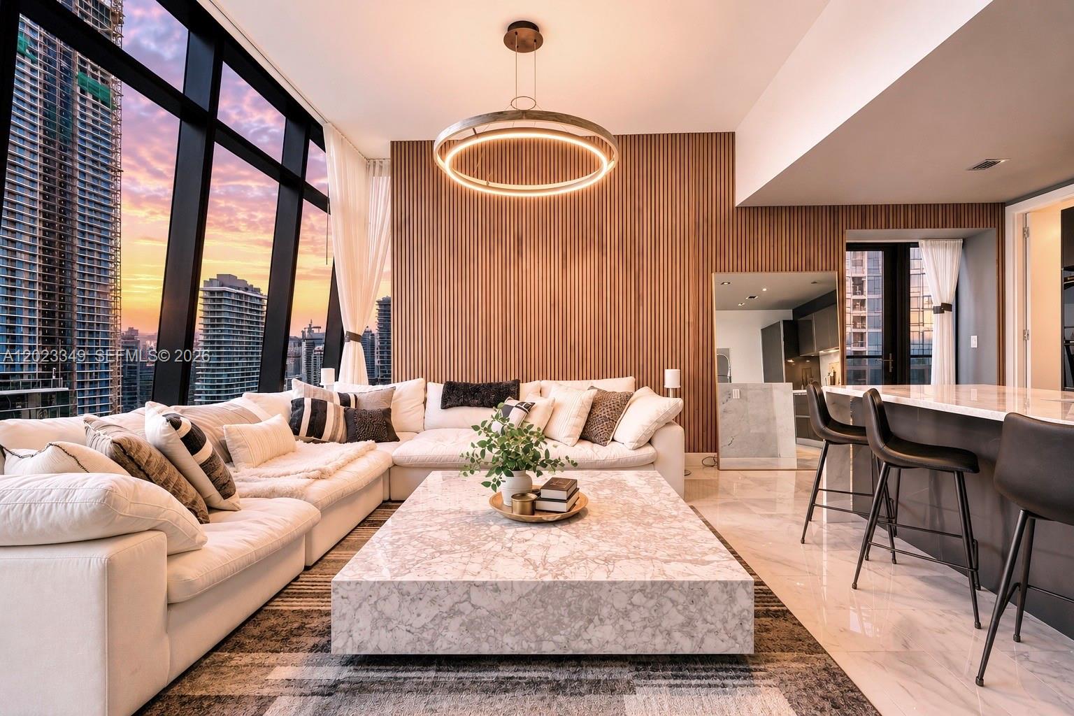 A modern living room features a white sectional sofa, marble coffee table, and floor-to-ceiling windows — 1451 Brickell Ave # 4304, Miami FL 33131, MIAMI, FL