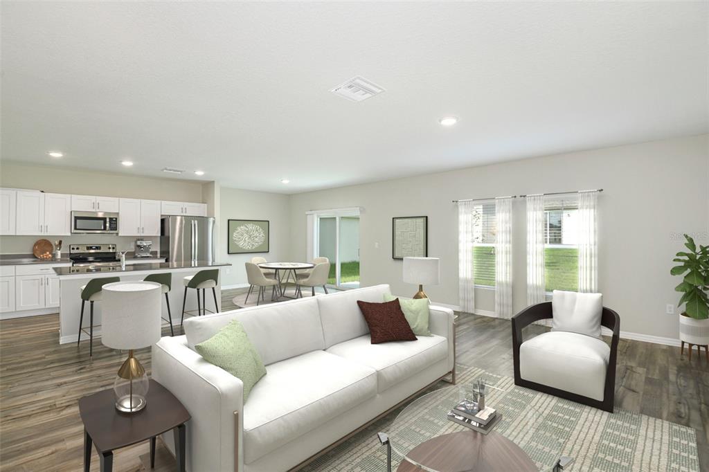 This is a digital rendering of an open-concept living room and kitchen with wood flooring — 1719 VANILLA STREET, HAINES CITY, FL