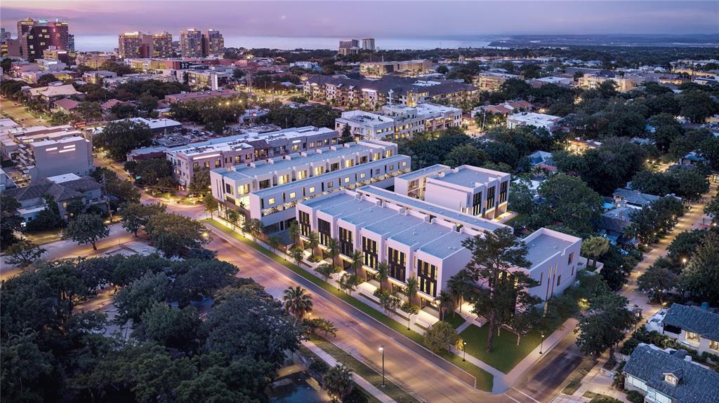 This is a rendering of a modern multi-unit residential complex at dusk — 1611 4TH STREET UNIT B6, SARASOTA, FL