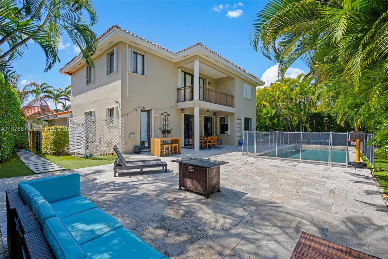 A two-story house with a backyard patio, swimming pool, and outdoor seating area — 7515 SW 191st St, Cutler Bay FL 33157, CUTLER BAY, FL