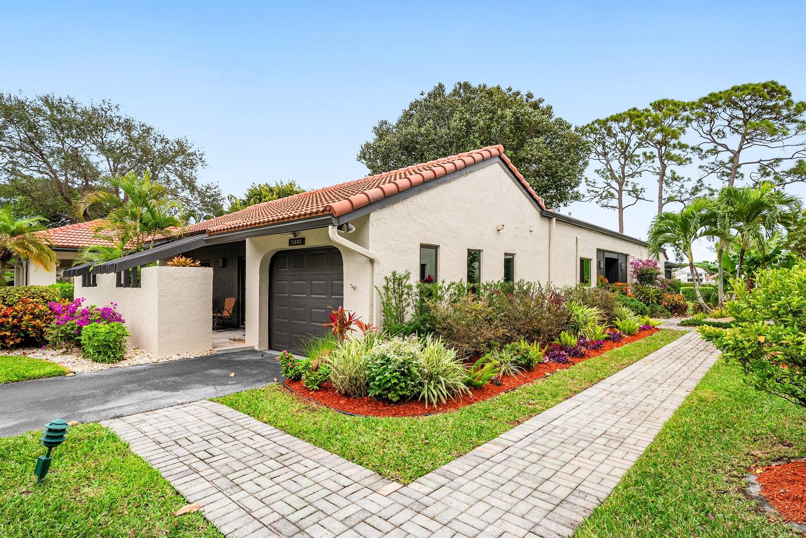 A single-story house with a tiled roof, garage, and a brick walkway through the yard — 21680 Tall Palm Circle # B, Boca Raton FL 33433, BOCA RATON, FL