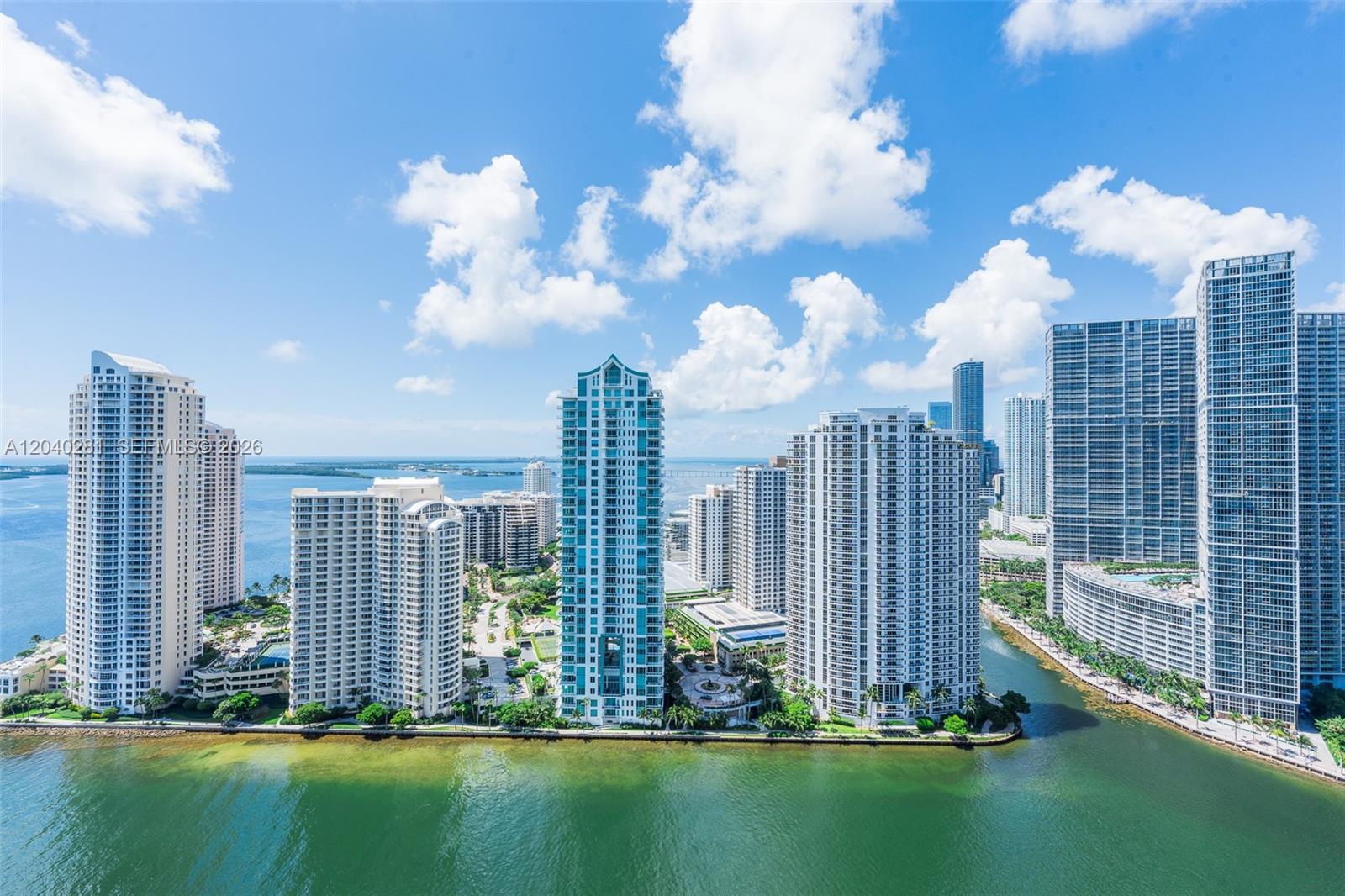 An aerial view of high-rise apartment buildings along a waterfront in a city — 325 S Biscayne Blvd # 3821, Miami FL 33131, MIAMI, FL