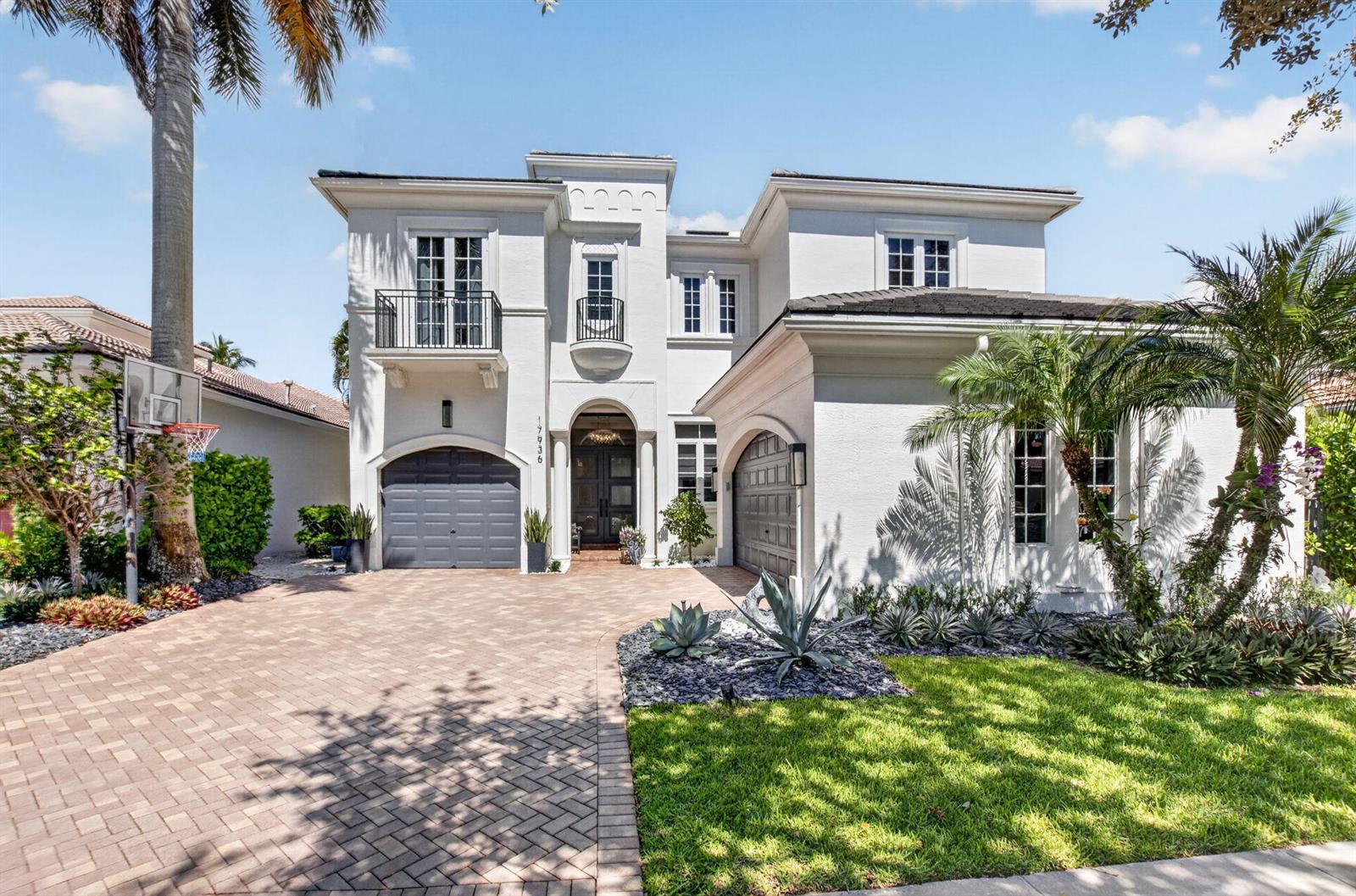 A two-story white stucco house with a paver driveway, two garages, and a front balcony — 17936 Villa Club Way, Boca Raton FL 33496, BOCA RATON, FL