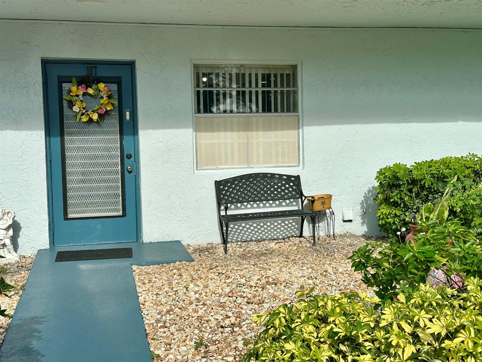 A kitchen features wood cabinets, stainless steel appliances, granite countertops, and light tile flooring — 1650 NW 80th Avenue, Margate FL 33063, MARGATE, FL