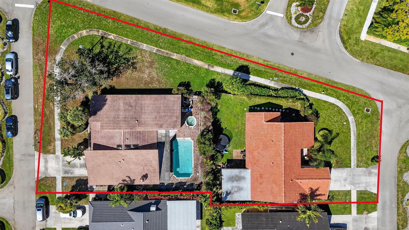 An aerial view shows two houses with tiled roofs, a swimming pool, and a fenced yard — 22220 Morning Glory Terrace, Boca Raton FL 33433, BOCA RATON, FL