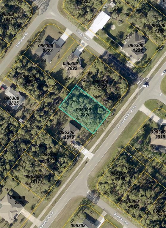 This is an aerial map showing a vacant lot highlighted in blue among residential properties — N CRANBERRY BOULEVARD, NORTH PORT, FL