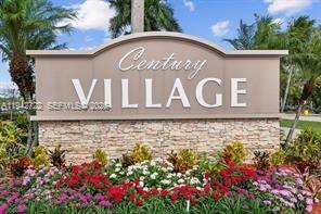 A stone-based monument sign for Century Village stands in front of a landscaped garden — 38 Northampton B # 38, West Palm Beach FL 33417, WEST PALM BEACH, FL