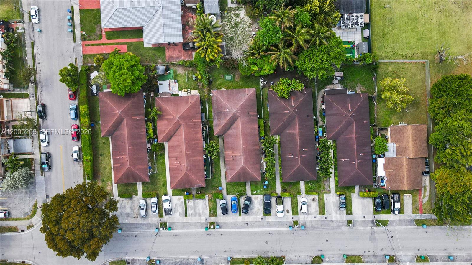 An aerial view shows a row of five identical residential buildings with brown roofs — 11002 SW 3rd St, Sweetwater FL 33174, SWEETWATER, FL