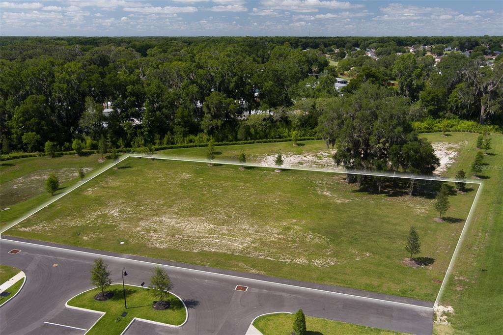 An aerial view shows a vacant, rectangular residential lot bordered by a paved road — 4820 NW BLITCHTON ROAD, OCALA, FL