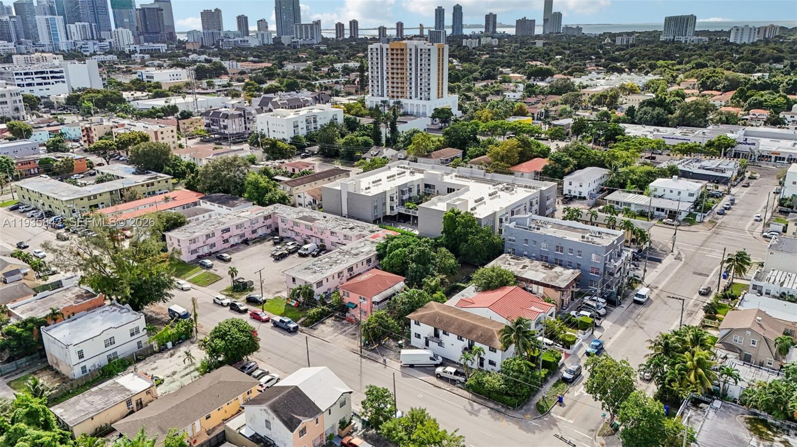 An aerial view shows a dense urban neighborhood with multi-story apartment buildings and residential streets — 984 SW 6th St, Miami FL 33130, MIAMI, FL