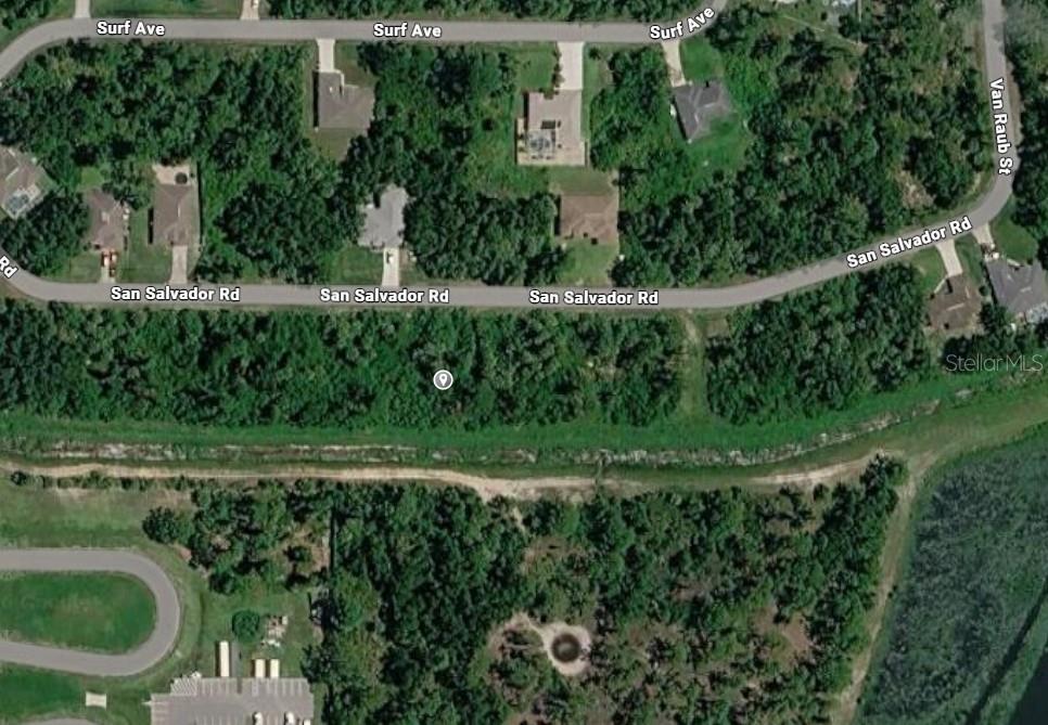 This is an aerial map view of a residential area with wooded lots and roads — SAN SALVADOR ROAD, NORTH PORT, FL