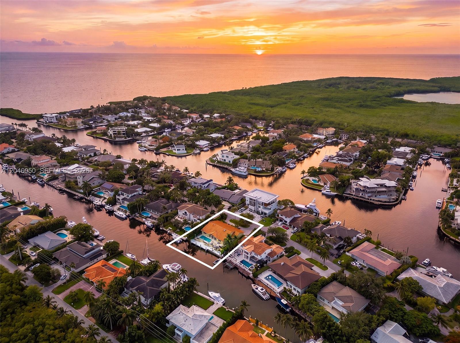 An aerial view shows a waterfront house with a pool highlighted by a white border — 1115 San Pedro Ave, Coral Gables FL 33156, CORAL GABLES, FL