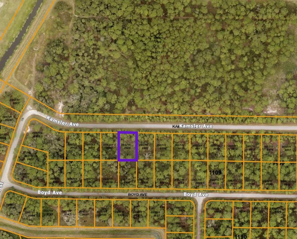 This is an aerial map showing a highlighted vacant lot among other undeveloped residential parcels — KAMSLER AVE, NORTH PORT, FL