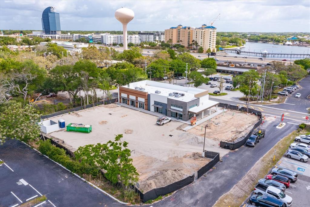 An aerial view shows a newly constructed commercial building surrounded by a dirt lot — 286 DOUGLAS AVENUE, ALTAMONTE SPRINGS, FL