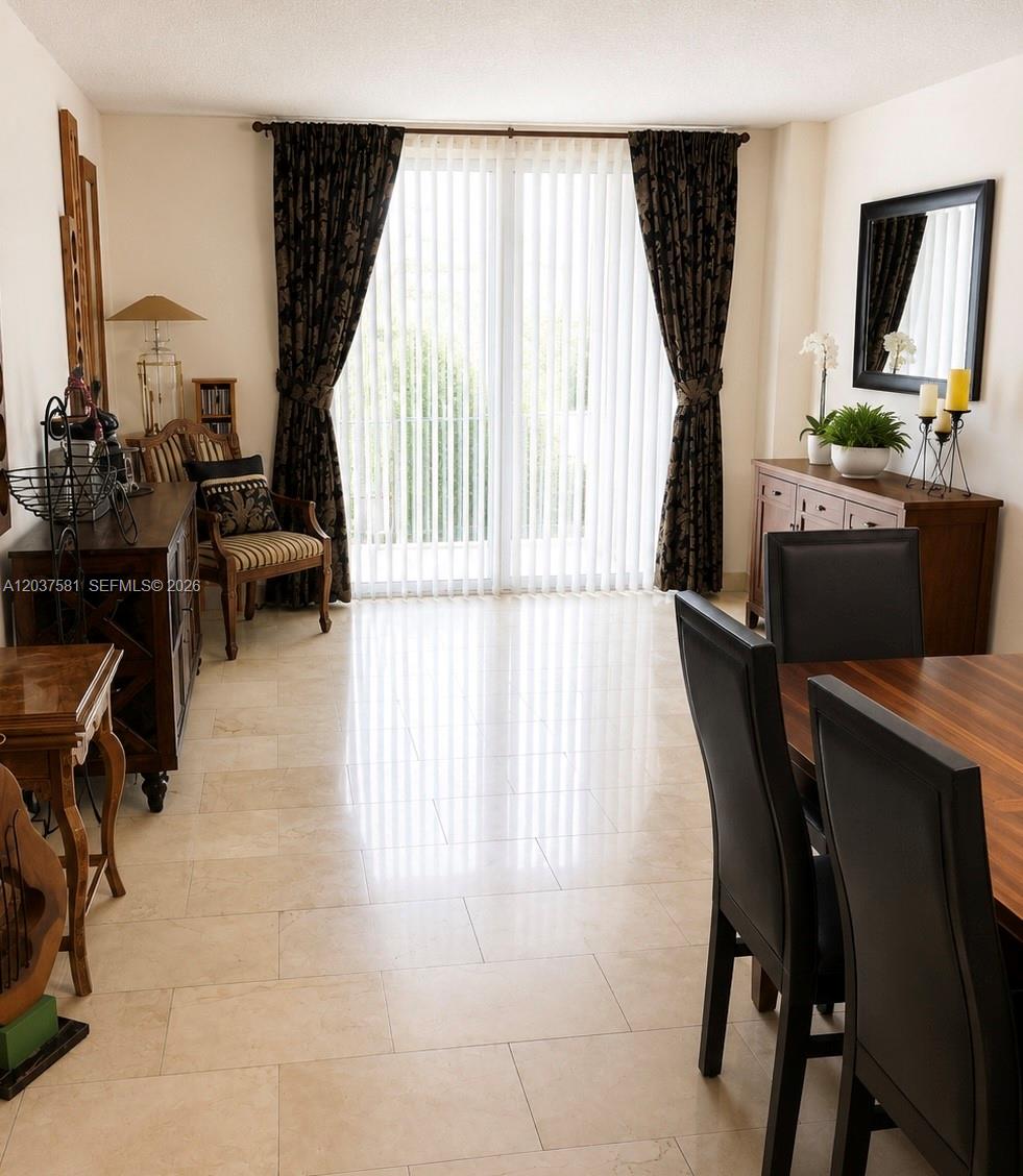 A walk-in closet features white walls, tan carpeting, and two levels of wire shelving — 2821 N Miami Beach Blvd # T, North Miami Beach FL 33160, NORTH MIAMI BEACH, FL