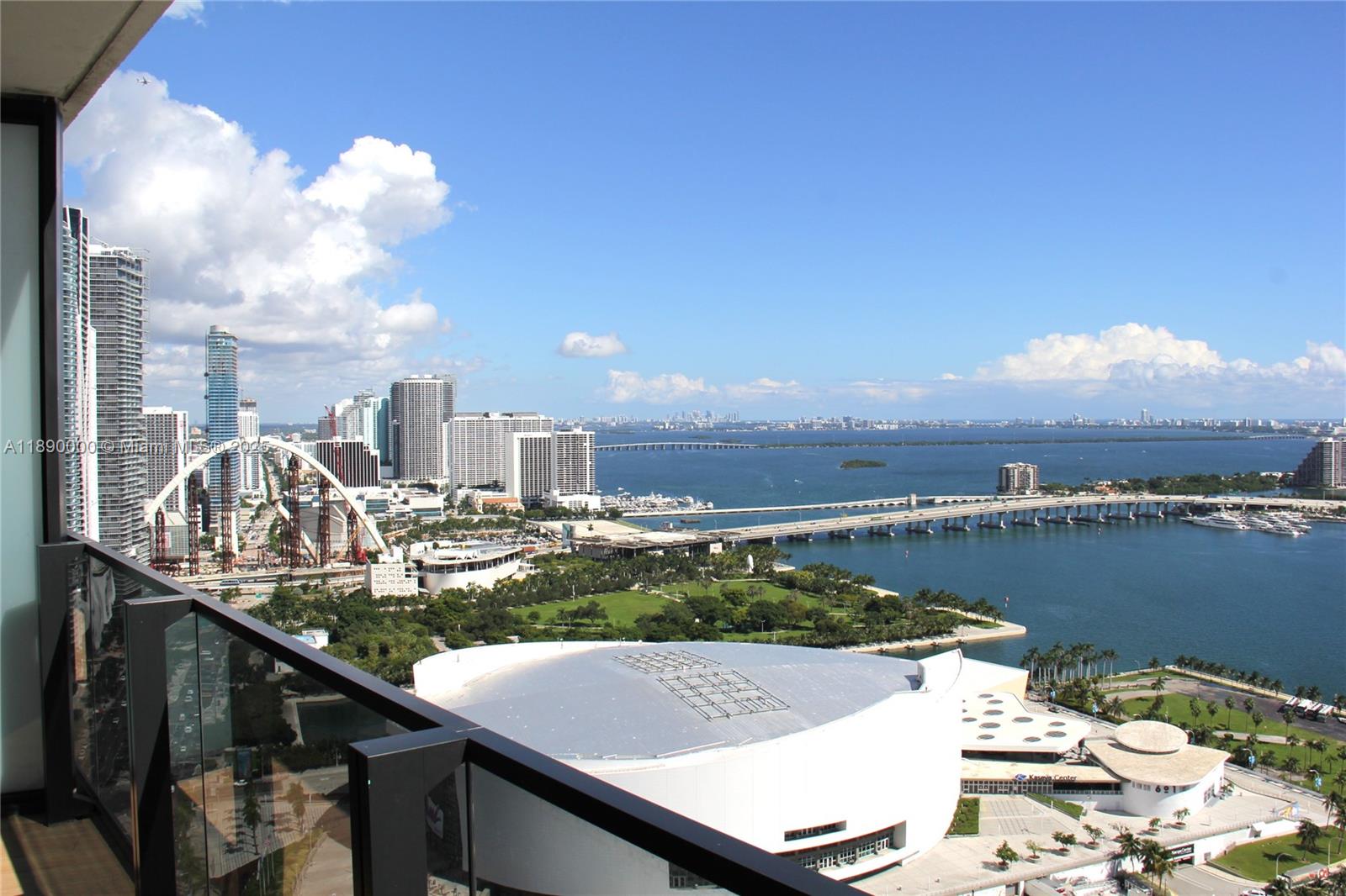 A high-angle view from a balcony overlooking the Miami skyline, bay, and arena — 398 NE 5th St # 3310, Miami FL 33132, MIAMI, FL